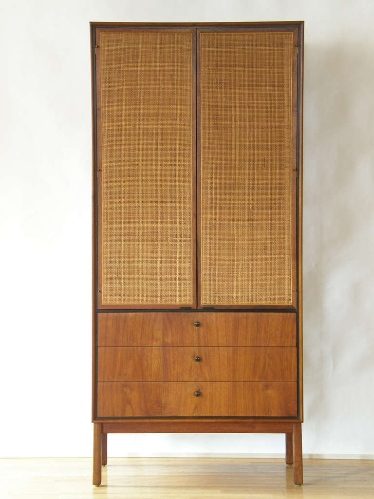 Tall & slender, walnut chest with cane doors. Bought in the 1960's from the Directional showroom, Chicago.

Please use Contact Dealer button if you have any questions.