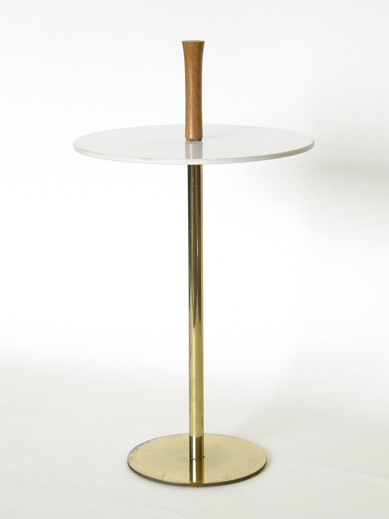 Minimalist side table or drink stand with brass base, Carrara Glass (Vitrolite) surface and wooden handle. 

The height of the glass surface is 16.25