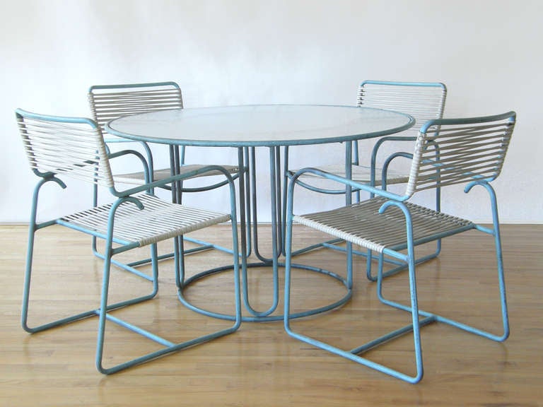 Tubular bronze dining table and four chairs with weathered verdigris patina designed by Walter Lamb, made by Brown Jordan.

Please use Contact Dealer button if you have any questions.