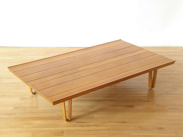 An uncommon variation of Wormley's Long John bench. Sap-streaked walnut platform floating on bentwood legs. Very good original condition.

Please use Contact Dealer button if you have any questions.