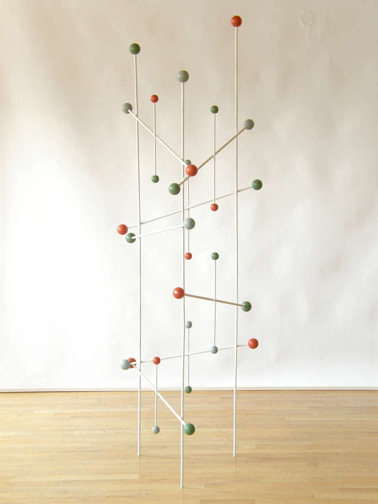 Fun hat rack or display stand. The iron rod and wood ball construction is reminiscent of a scientific, molecular model. This vintage store display makes a great free-standing sculpture as it is.

Please contact us if you have any questions.