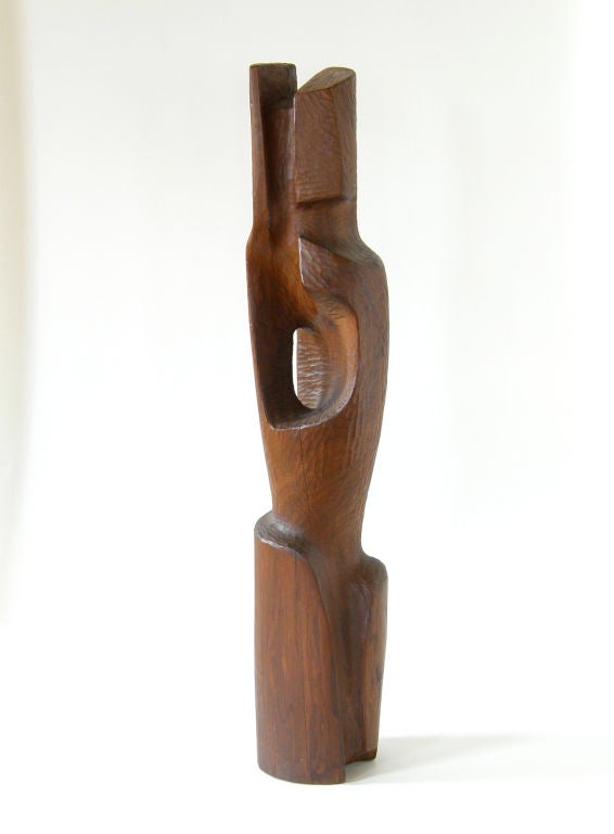 Best known for his furniture designs of the late 1960's and 70's, this is an early work by Wisconsin woodworker Daniel K.  Jackson.

Born in Milwaukee in 1938, Jackson began carving at an early age and continued to work with wood for his entire