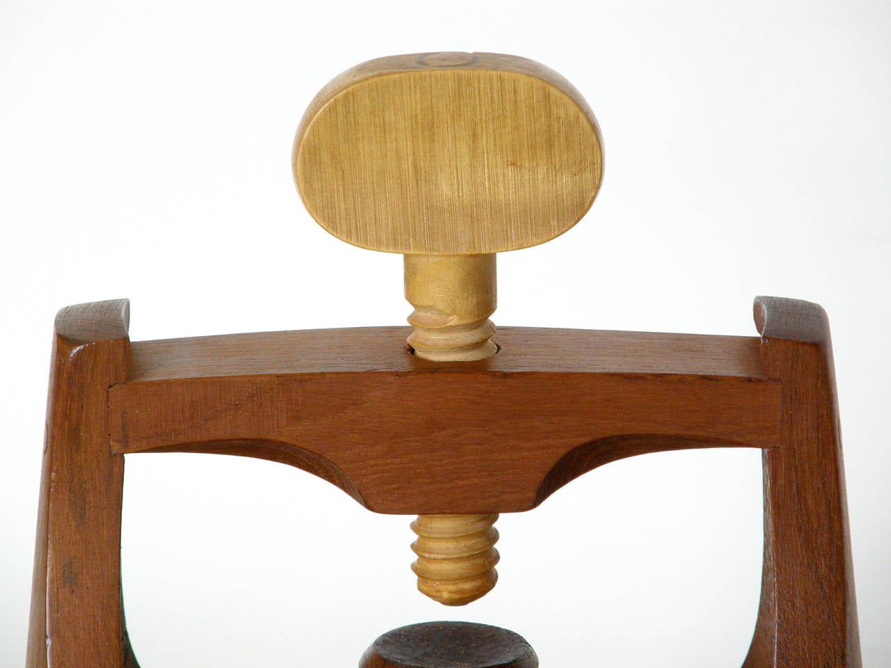 Staved teak bowl with integrated, screw down nutcracker designed by Jens Quistgaard for Dansk.