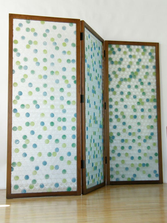 Three panel screen of molded circles pattern glass with blue and green painted dots finish. Set in walnut frames. Outer panels 35