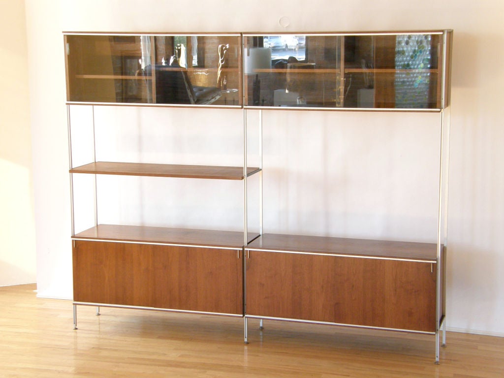 This simple and elegant storage unit was designed by Hugh Acton. It has aluminum supports and a walnut shelf and storage boxes. It knocks down for easy shipping, and the elements can be re-arranged.
Please use Contact Dealer button if you have any
