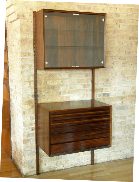 Rosewood wall unit with display cabinet & chest of drawers designed by Poul Cadovius.

2 units available, nice for a larger system, last pic shows both units hung together
$1400.00 (each unit)
Please use Contact Dealer button if you have any