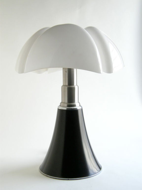 The Pipistrello (Bat) lamp was designed by Gae Aulenti in 1966 for Martinelli Luce, Italy. Telescoping steel base, 4 fixtures within shade.