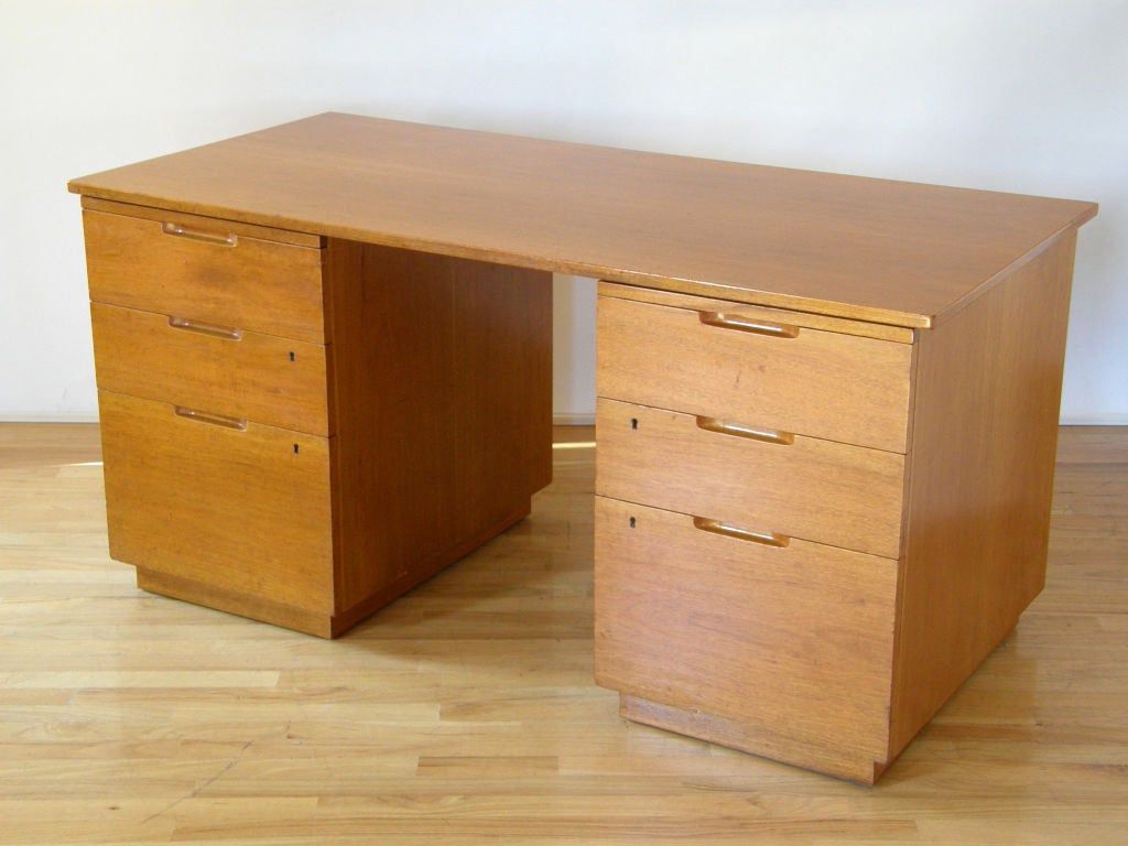 The model #500 mahogany desk designed by Alvar Aalto, made in Sweden for Artek, Finland. Six drawers with two pull-out work surface boards. A nice example of Aalto's clean modernist designs from the 1930's.

Please note that this desk is not made in