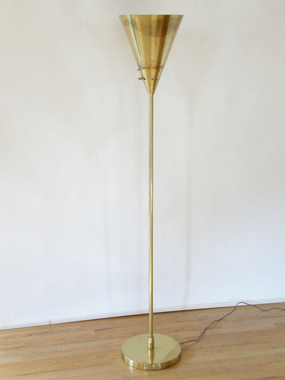 This classically simple torchiere floor lamp was designed by Harry Weese for Baldwin-Kingery, Chicago. It's beautifully made from a heavy gauge of brass and provides a soft, indirect light.

This example is a 2nd series production, which has a