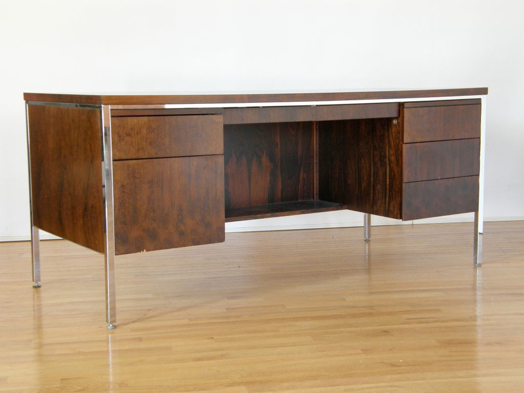 Rosewood and chrome desk with seven storage drawers and two slide out surfaces, partitioned modesty panel, very solid construction. By Alma Desk Co., High Point, N.C.
Please use Contact Dealer button if you have any questions.