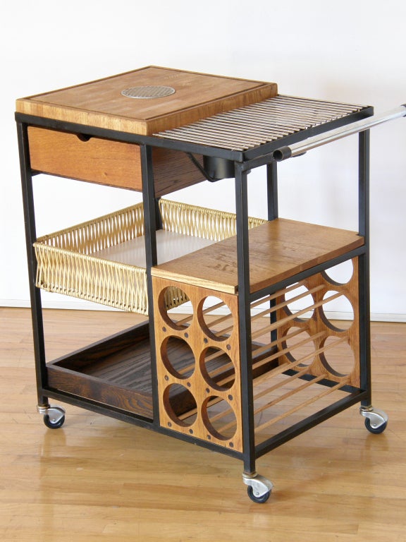 Serving cart designed by Arthur Umanoff. Cutting board, heating grill, wine rack and storage. A necessary piece for the patio lifestyle.
Please use Contact Dealer button if you have any questions.