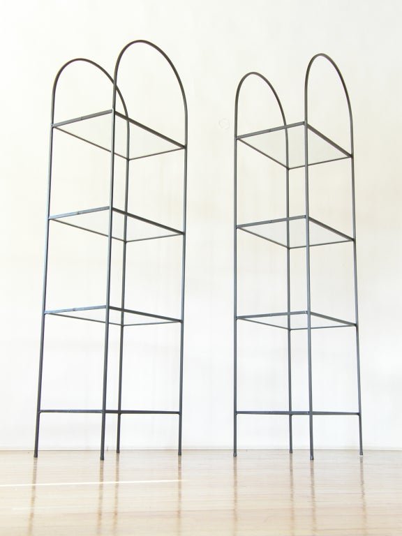 Pair of iron and glass arched shelving units . A nice minimalist version of the traditional etagere form. Attributed to Frederick Weinberg, from his line of commercial display pieces.
Please use the Contact Dealer button if you have any questions.