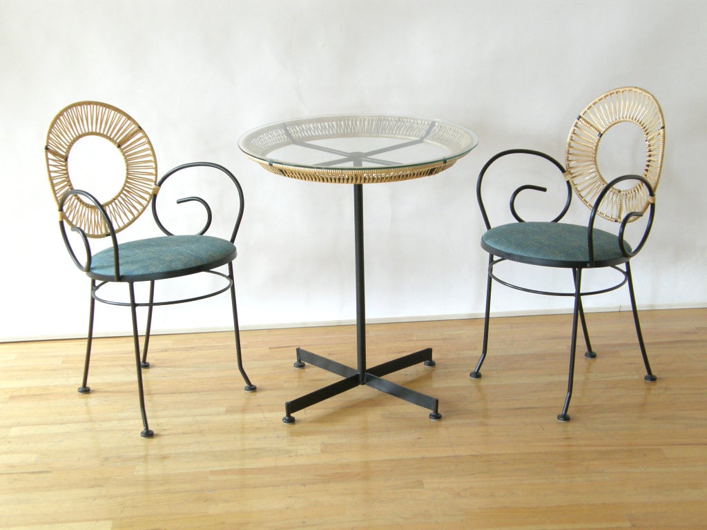 Iron and clear plastic covered split reed cafe table and chairs designed by Arthur Umanoff for Raymor.
Please use the Contact Dealer button if you have any questions.
