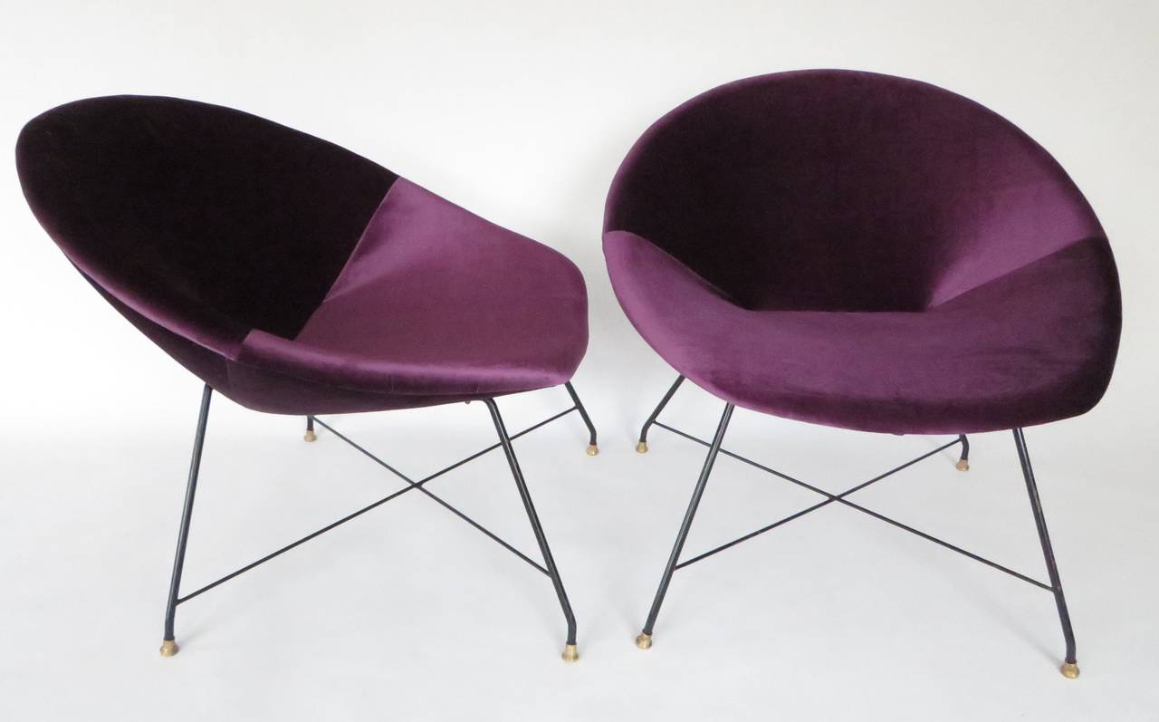A pair of Augusto Bozzi for Saporiti Italian lounge chairs, reupholstered in a lustrous aubergine velvet. Sitting on delicate black iron enameled legs with brass sabots.
H 28.
W 30.5.
Seat H 15.5.
Seat depth 18.
Depth 28.
Footprint 24 x 23.