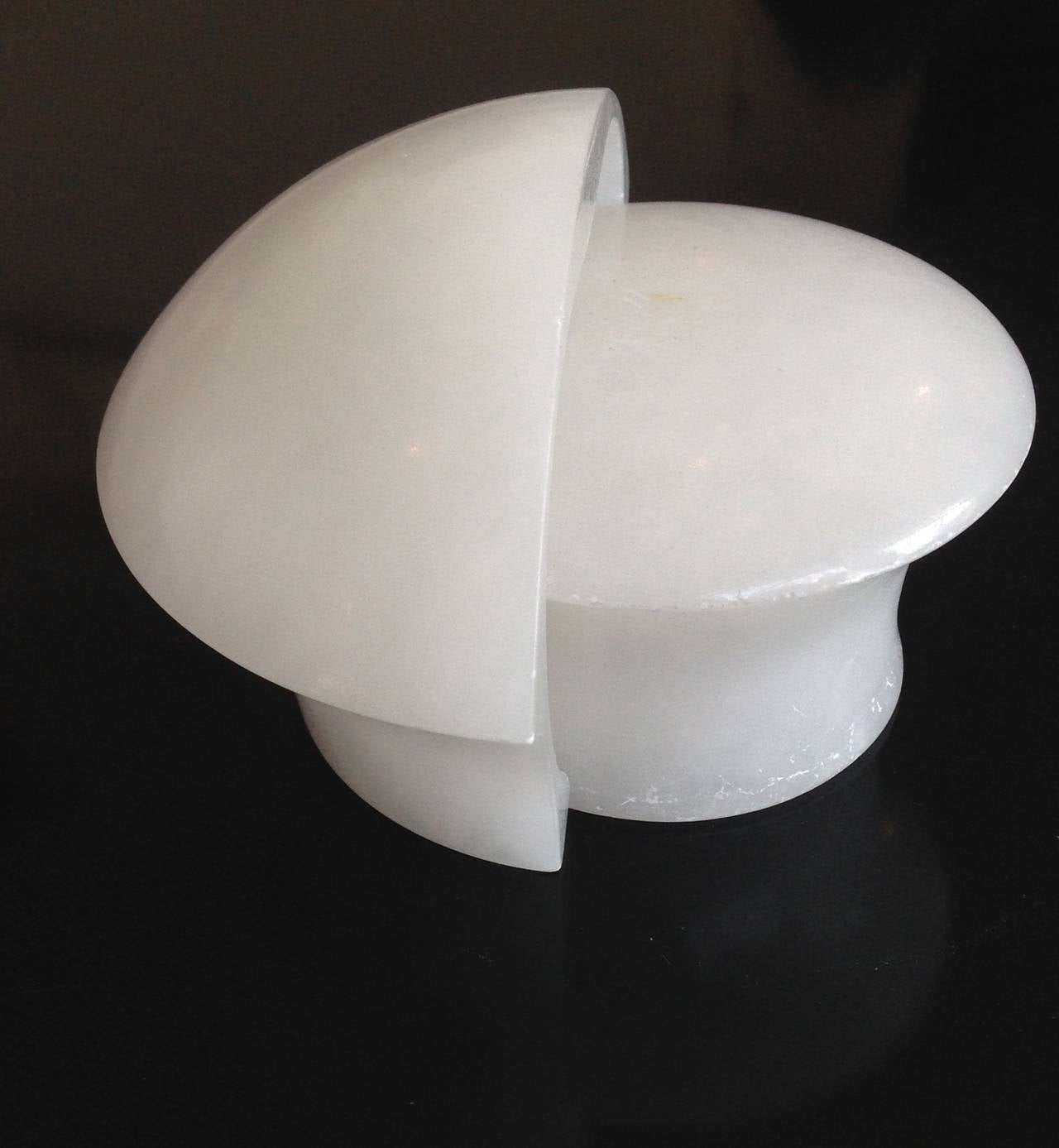 An alabaster sculpture by Angelo Mangiarotti titled Volterra made by the Itallian Cooperative Artieri Alabasstro. c1980
No chips, cracks or restorations. Very white alabaster. 
The round part of the sculpture is 4.5