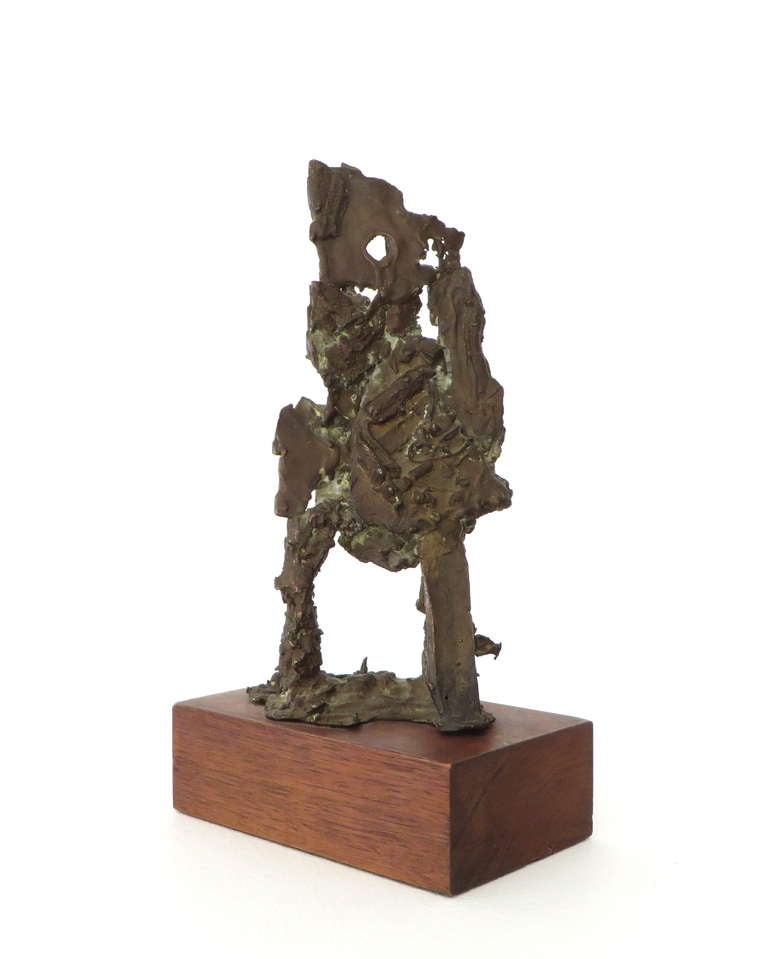 Abstract figurative bronze sculpture mounted on a walnut base. c 1960 USA
Unsigned.
Bronze sculpture dimensions without base are 10