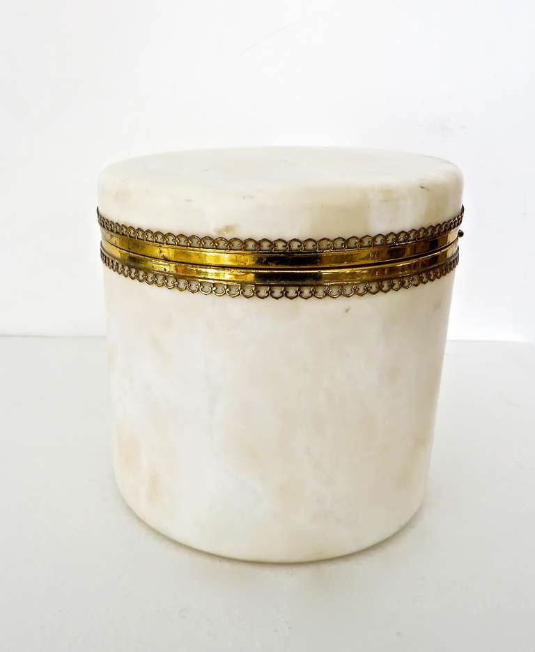 Beautiful decorative  Italian alabaster round box with decorative brass trim intended for a dressing table c 1940's.