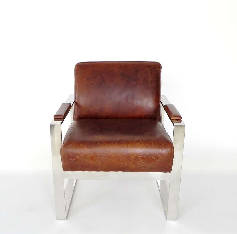 Modernist and very handsome cubist French leather and nickel chrome lounge or club chairs. Beautiful patina of the leather. Wonderful condition with no tears. 
Actual Leather seat dimensions 19