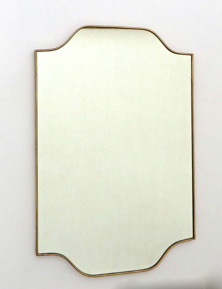 Brass framed Italian mirror, Italy, c. 1950. Brass shows beautiful, age appropriate patination. Wood back.