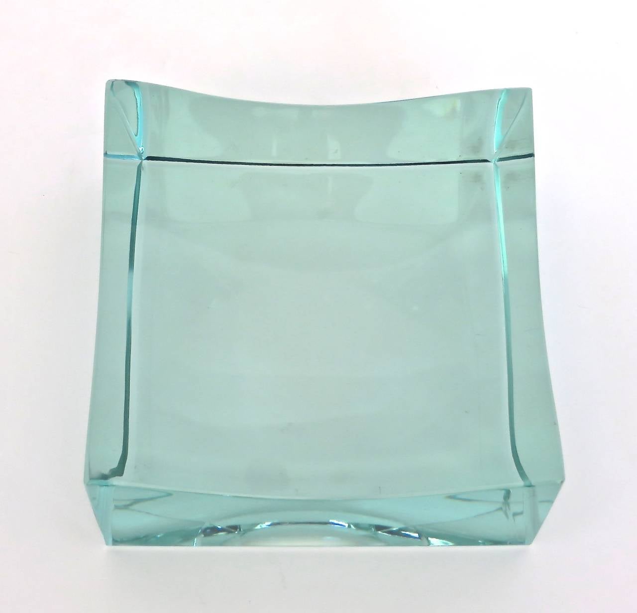 Fontana Arte signed vide poche. Italian cast glass with makers mark FX on the side. Clear polished crystal. The lines seen in the photos are reflections from other objects. There are no lines in the object.
No chips or cracks. Perfect condition.