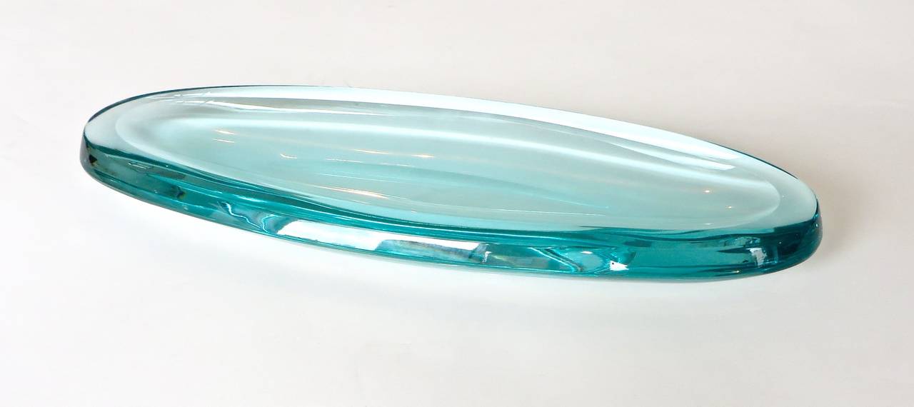Very thick Italian cast glass ovoid shaped dish or vide poche, by Fontana Arte. Excellent condition, with no chips or restoration. Almost no age appropriate wear.