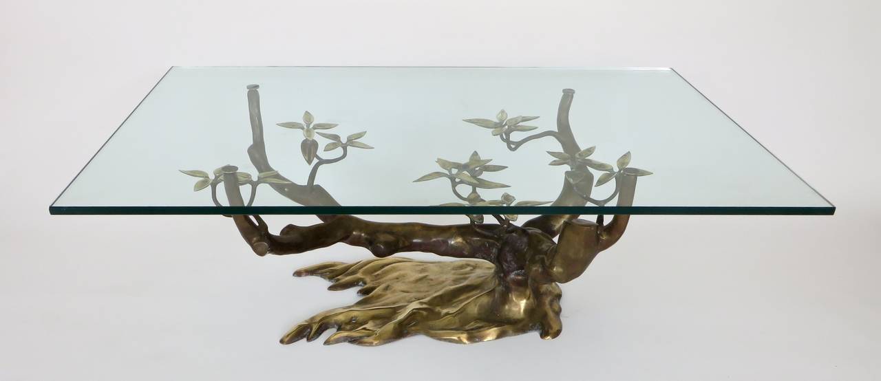 The now iconic Willy Daro bronze and brass organic bonsai coffee table. 
Each table with unique patina. 
Excellent condition. 
This glass in perfect condition and could be replaced with larger or smaller top.

Table with glass top measures: