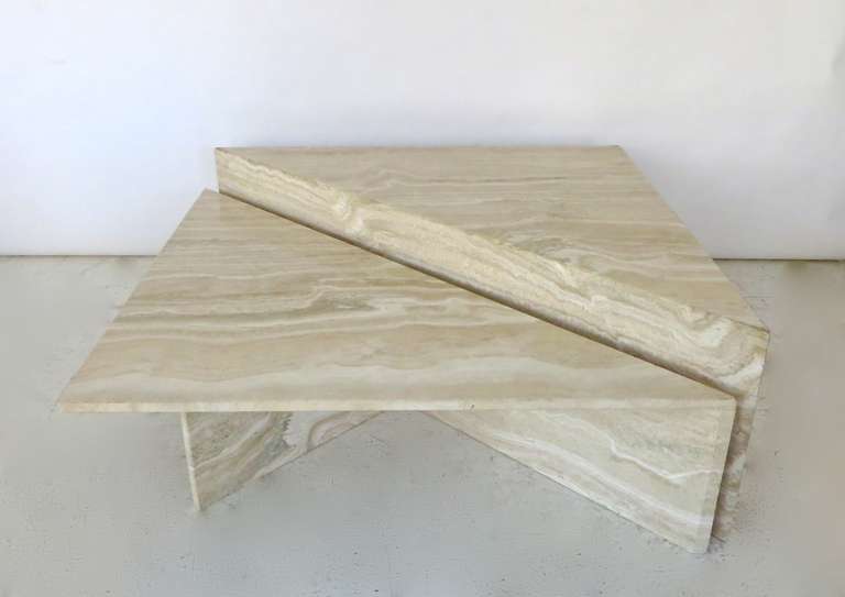 Two part and bi-level Italian travertine coffee table with possibility of multiple configurations. Amazing color and striations in the travertine.

No chips or scratches or restorations. 

The taller half is: 39.5