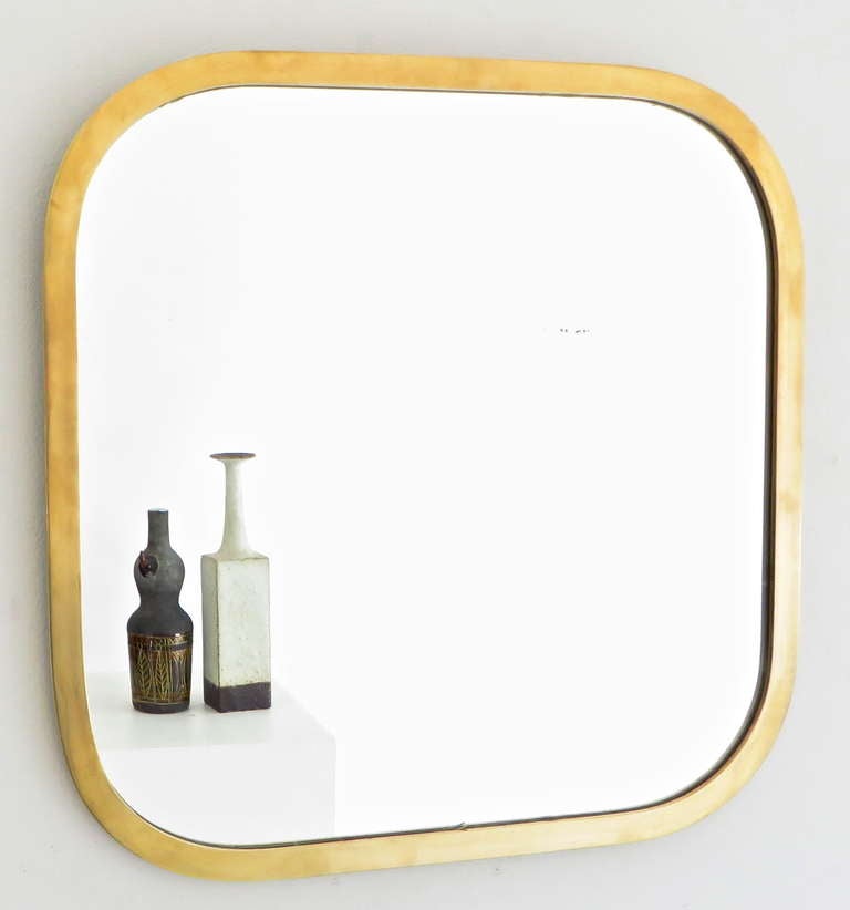 Italian modernist minimalist brass framed rounded corner mirror.