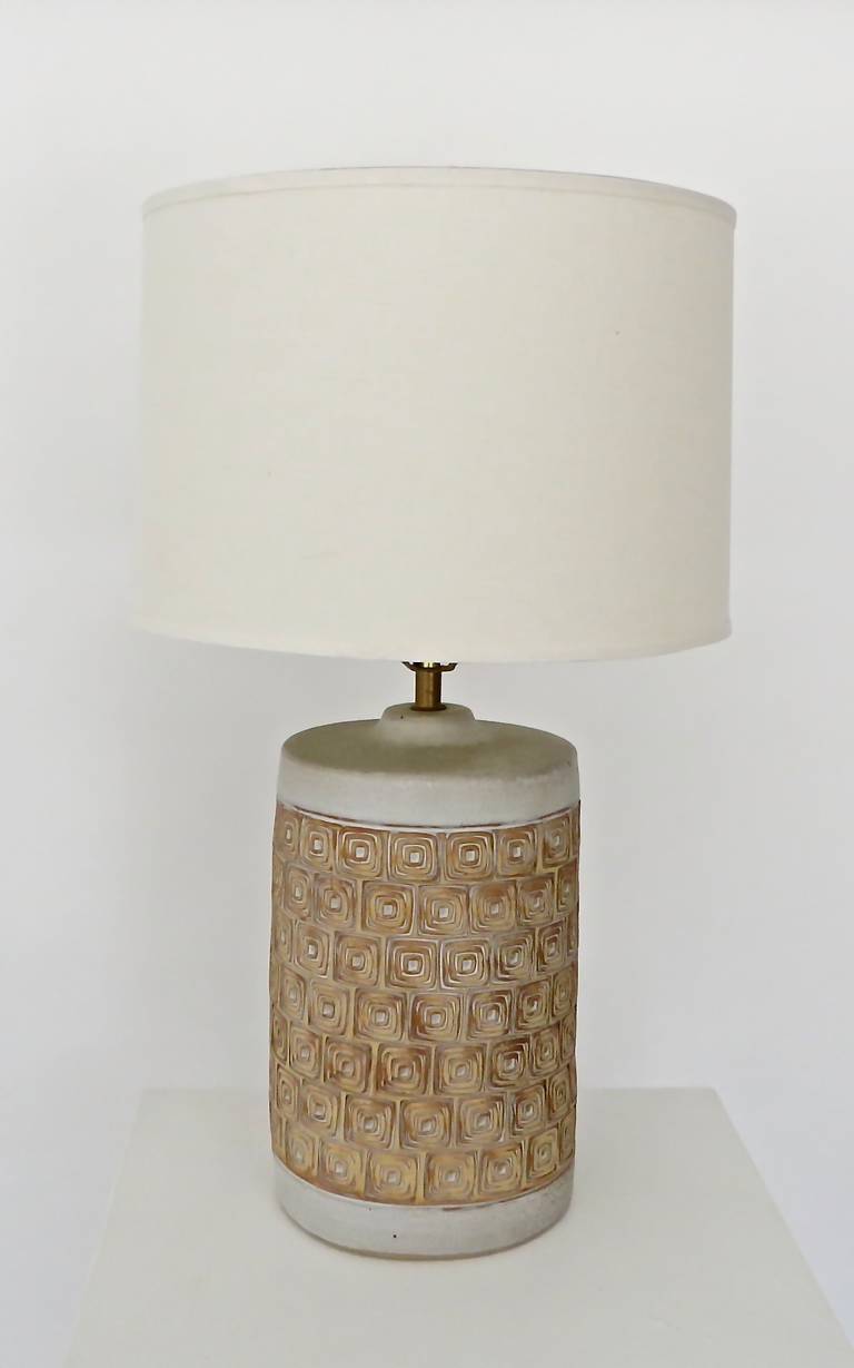 Greige ceramic lamp with greige glaze and darker biscuit brown incised pattern. 
No chips or restorations. Includes shade. 
Lamp Base only: 7