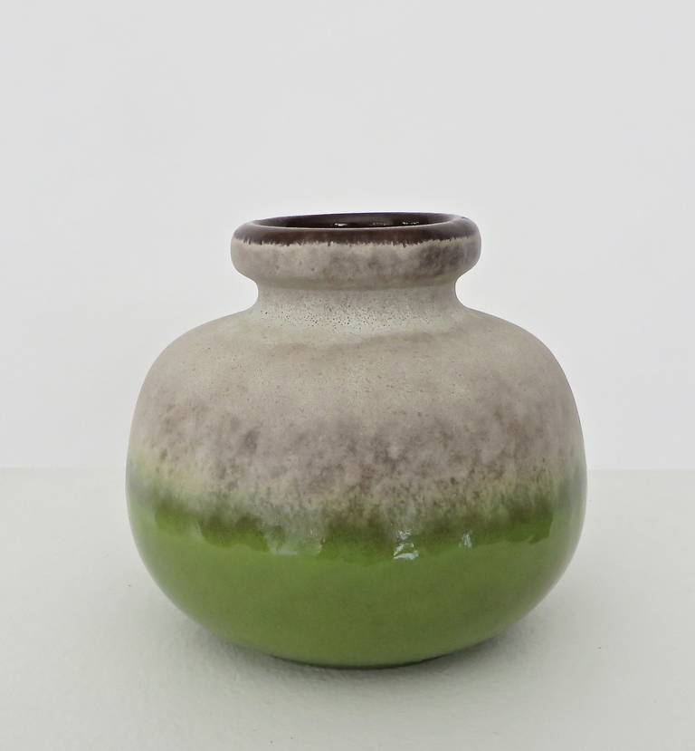 Ceramic vessel made in West Germany in green and lavender glaze. 
Generous form with lavender glaze breaking over the green.