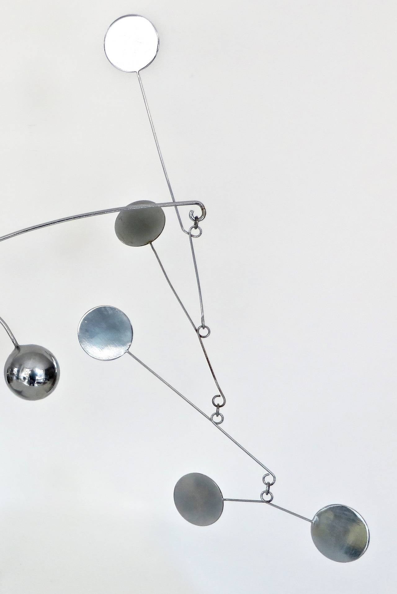 A table top size stabile mobile sculpture by the French artist Francois Collette. 
Chromed plated steel. Signed FC 78.
Collette was born on the French island of la Reunion in the Indian ocean, as an adolescent he moves to Paris in order to