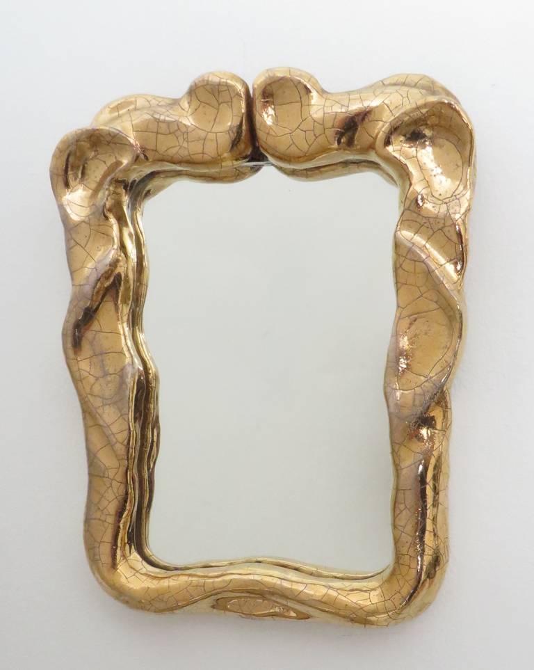 Small charming French gold crackle glazed ceramic mirror. Very Baroque and expressive in its modeling. Signed, circa 1970s.