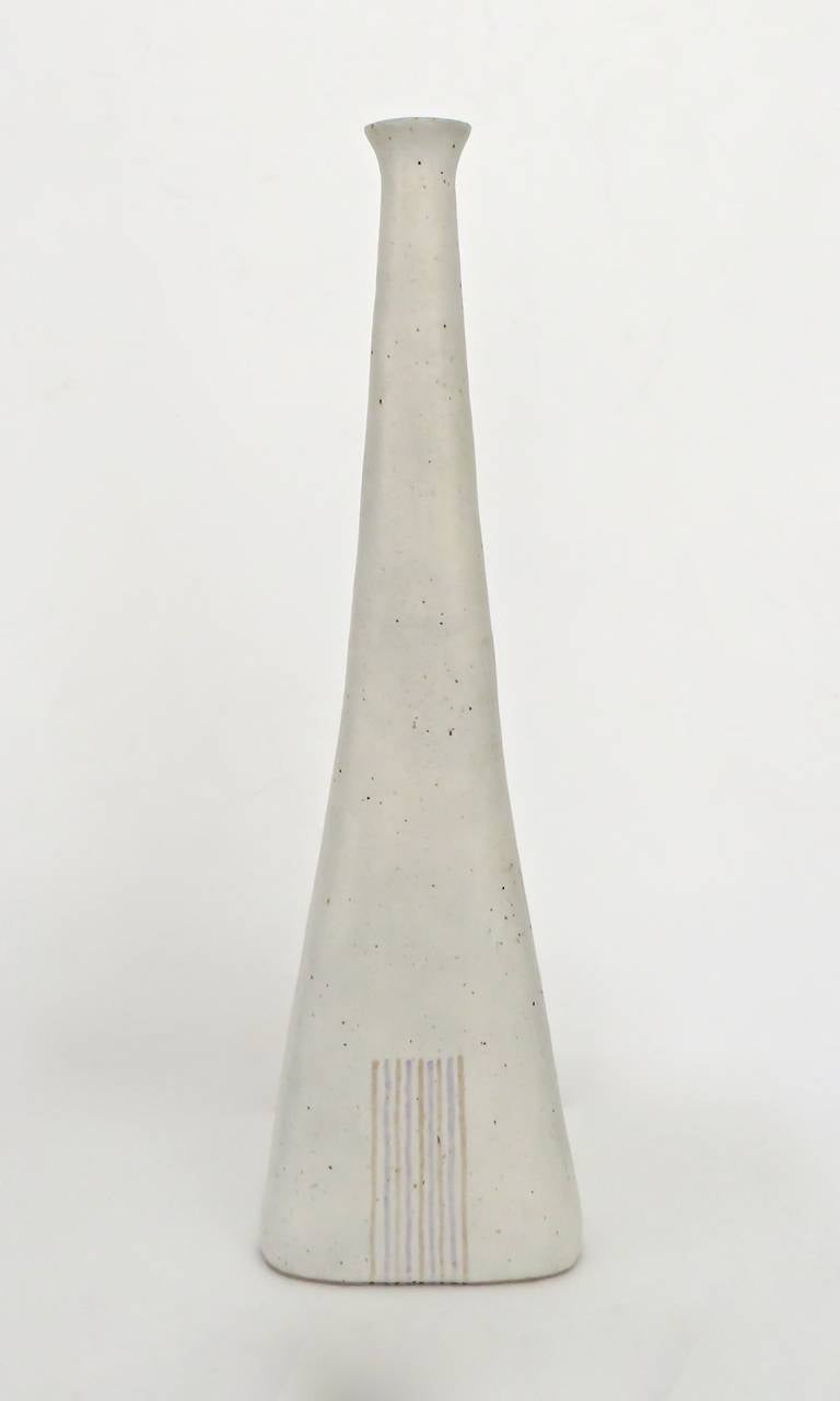Beautiful and large Italian ceramic bottle vase form by Bruno Gambone. Pale cream glaze with polychrome lines on both sides.
