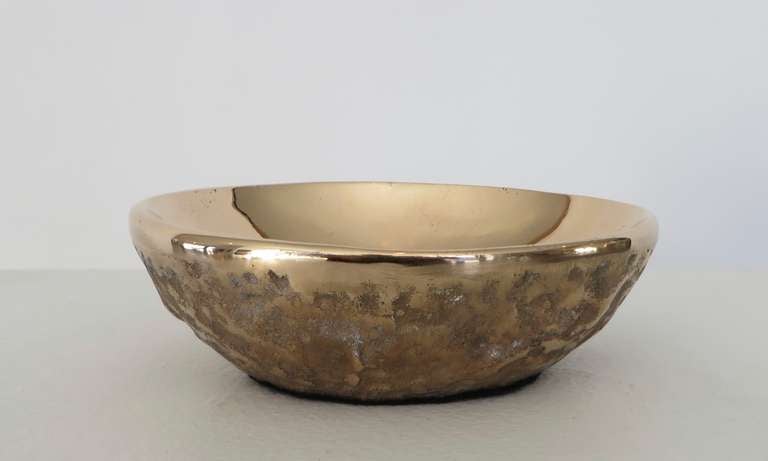 Bronze sculptural bowl by Ado Chale.
Beautiful mirror polished interior with a rough textured exterior.
Signed. Chale often gave these as gifts to clients who commissioned and purchased his large sculptural tables.