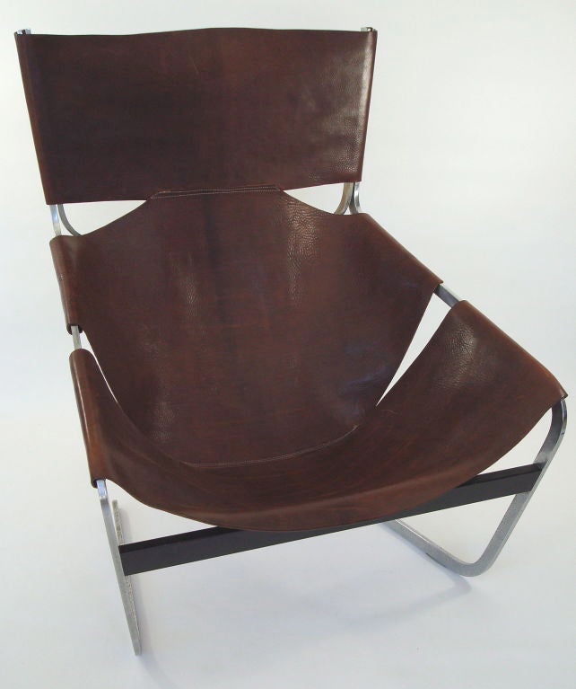 Brown leather with wonderful patina and steel chair for Artifort designed by Pierre Paulin. Pierre Paulin: Un Univers de Formes, Chapoutot, pg. 52 illustrates this model in situ at the Salon des Artistes Decorateurs Les Assises du Siege