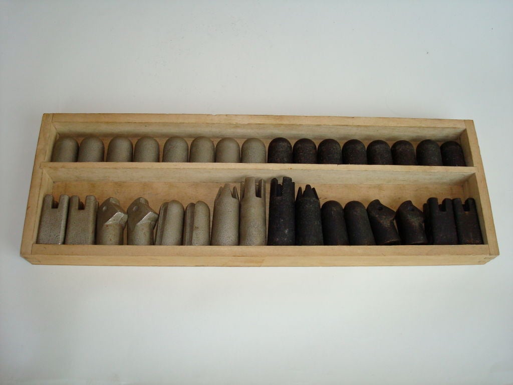 Bronze and steel modernist chess set. Very minimalist. Original box but no cover.<br />
sizes vary: 1.75