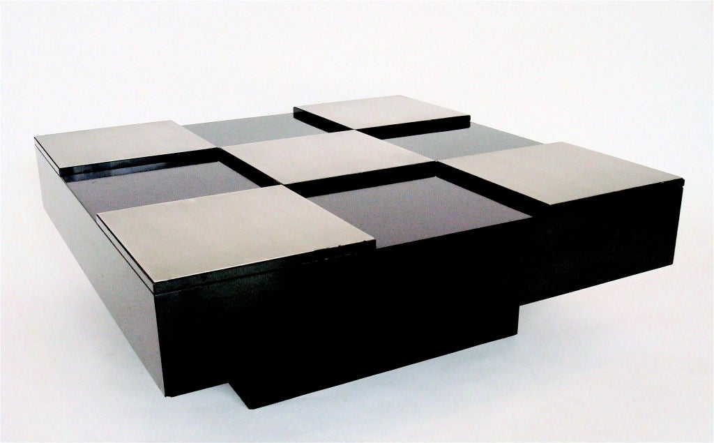 Checkerboard patterned french coffee table in black laminate and raised, brushed stainless steel.