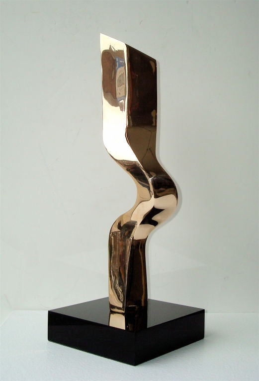 Cast bronze abstract sculpture set on a base of black marble, base measurements are  1.5