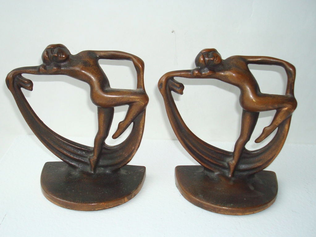 Pair of cast metal with copper plated finish dancing female art deco bookends.