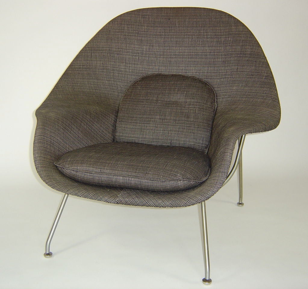Beautiful example of the Womb Chair, made by Knoll,with original upholstery.  First designed in 1948, this is from the 1980's. Brushed stainless steel legs.