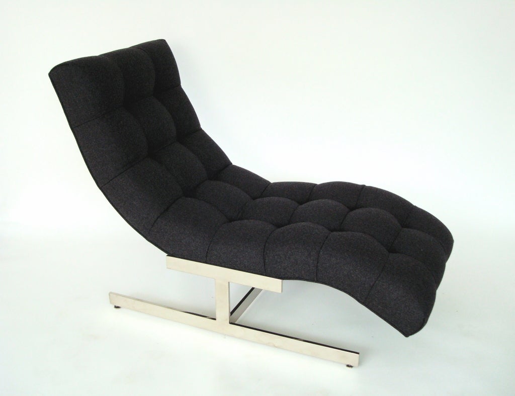 Deeply tufted, sculpted chaise on a chromed steel base, designed by Milo Baughman.  Newly reupholstered in charcoal grey Maraham Davina wool.