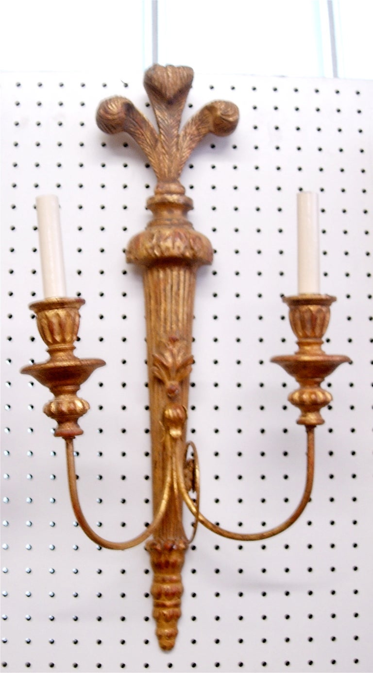 Pair of Italian giltwood two-arm sconces, electrified, Prince of Wales feather.