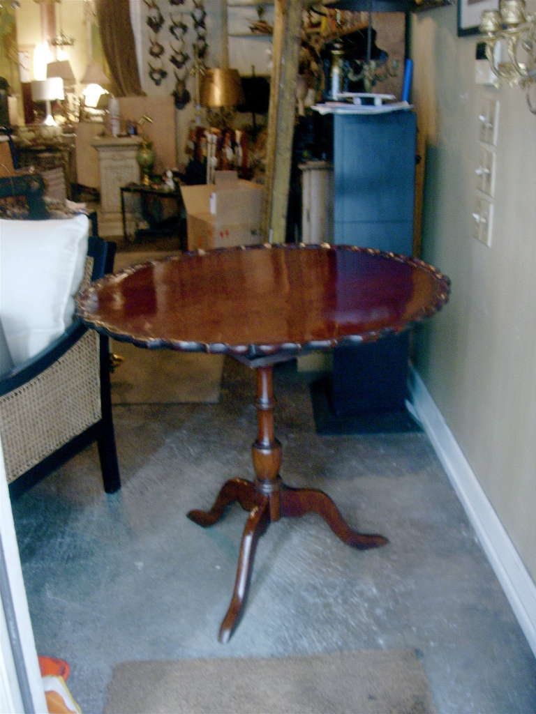 19th century American or English tea or center tilt-top table. Great height. Nice old patina.