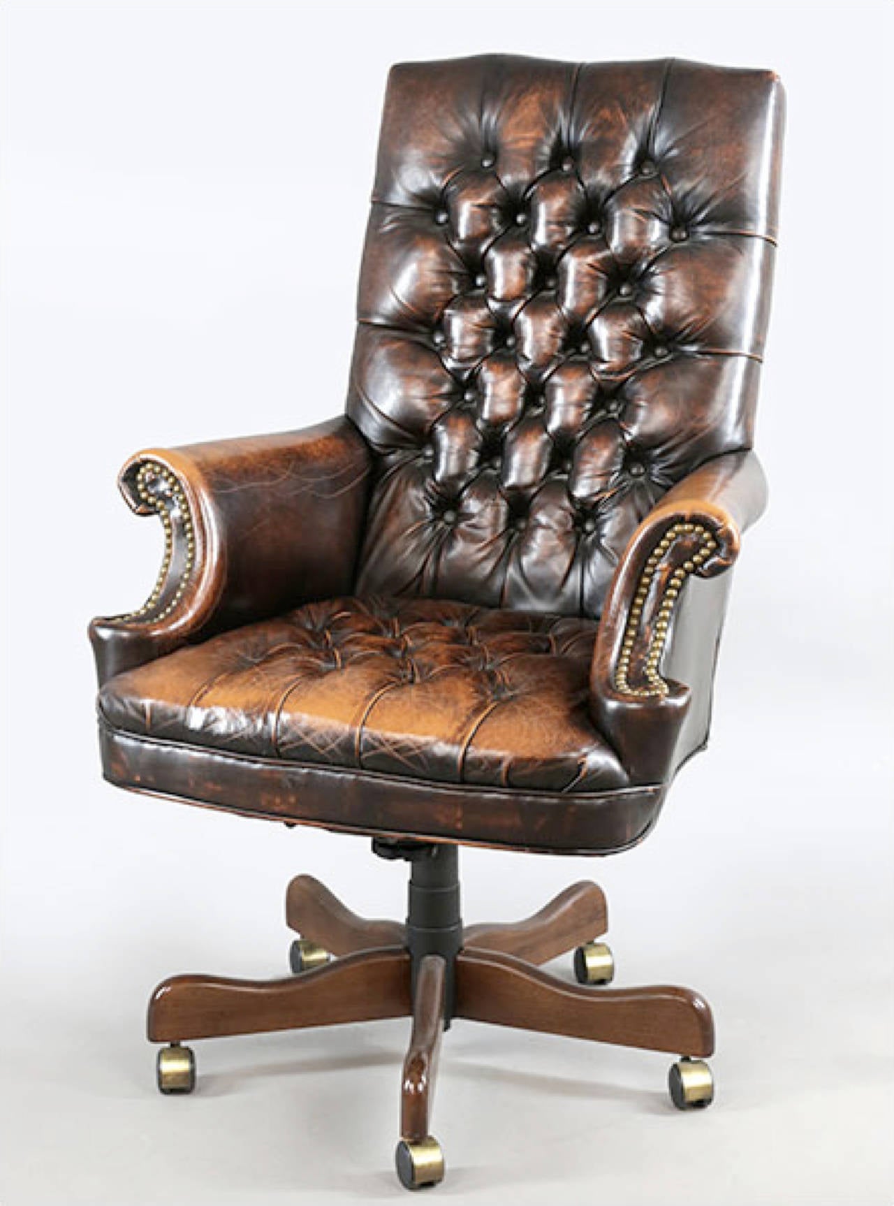 Handsome leather executive chair with lovely worn patina.