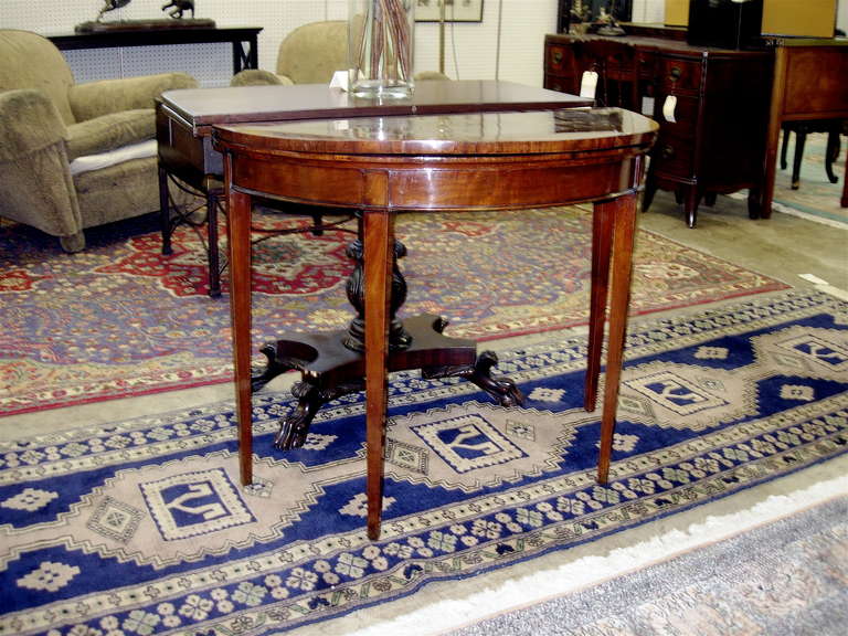 One pair of 18th century English mahogany demilune or games tables. Lined with leather tops, great old patina.