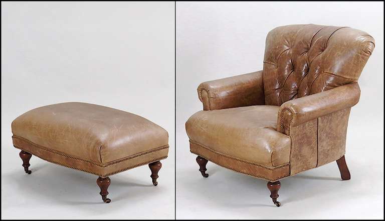 Handsome leather club chair and ottoman, nice old color and patina.