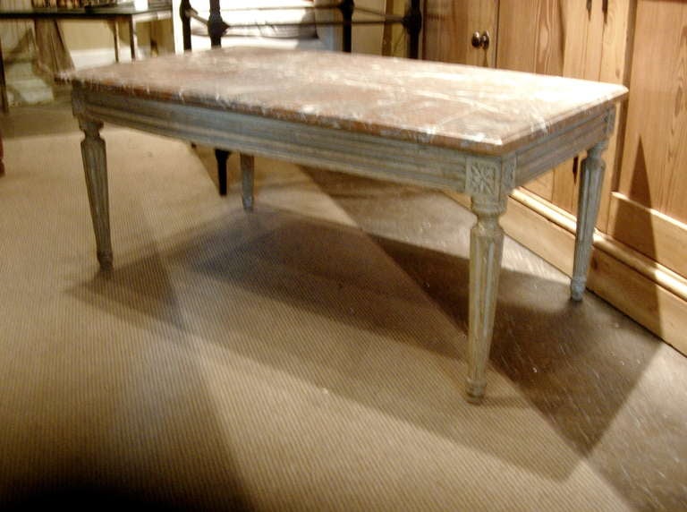 Louis XVI style coffee table with marble top also could be upholstered as a low bench. Wonderful old worn painted finish and patina.