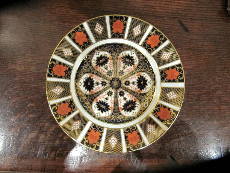 Set of eight Royal Crown Derby plates with serving platter, Imari pattern.