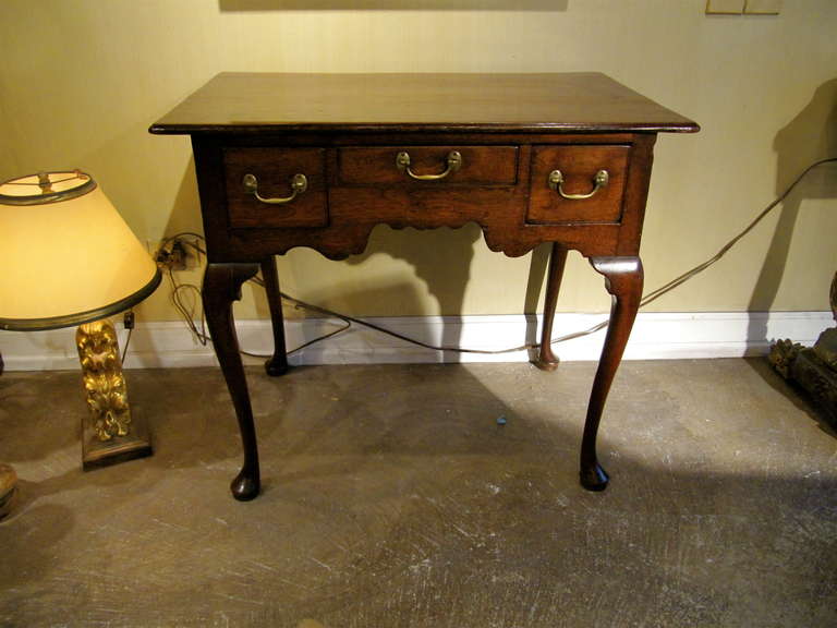 Handsome 18th century English oak lowboy, original hardware, lovely old color and patination.