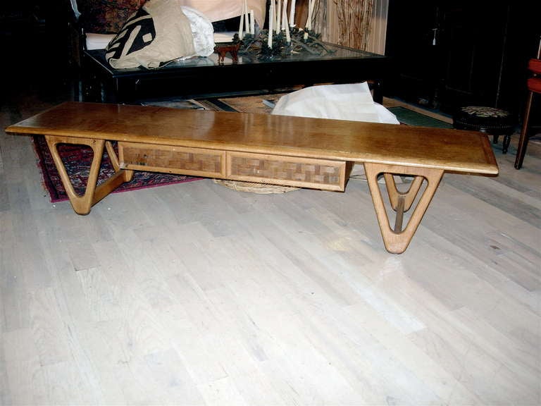 Midcentury coffee table of great form in the style of Persal.